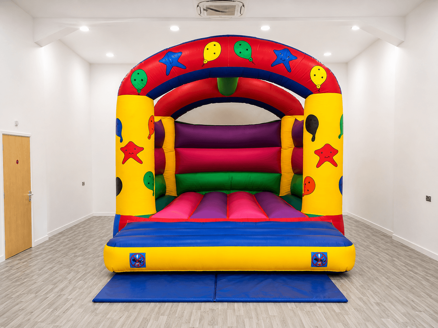 Colourful bouncy castle setup for a children's party from Cameron's Events