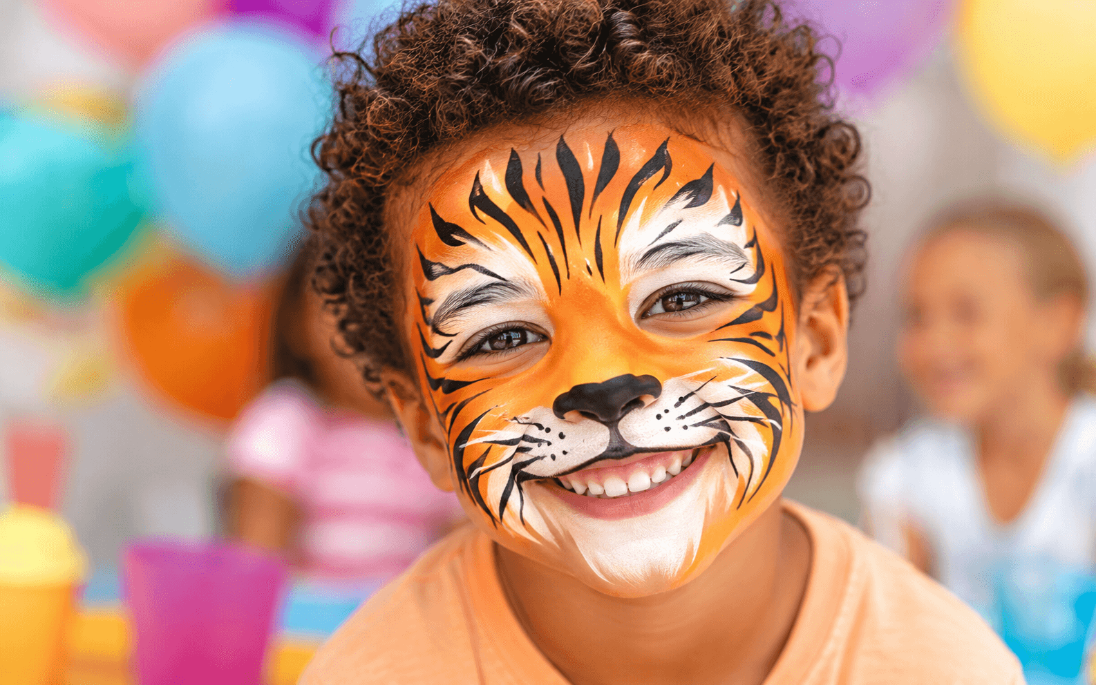 Child with colourful animal-style face painting