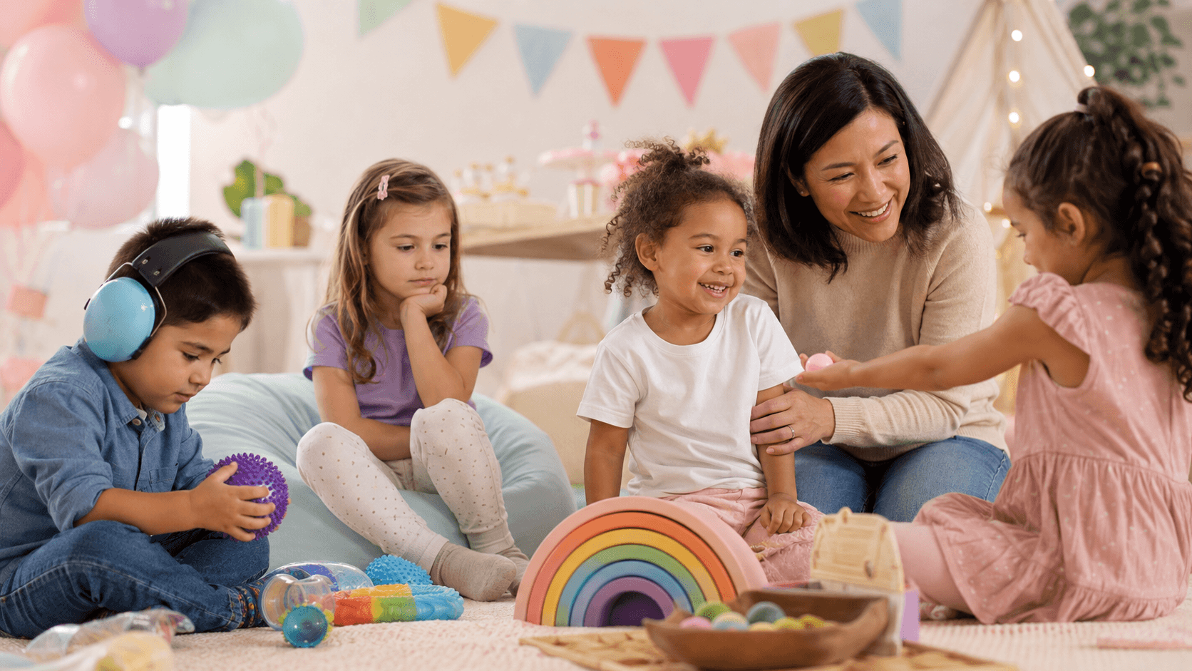 Children enjoying an inclusive sensory-friendly party in different ways