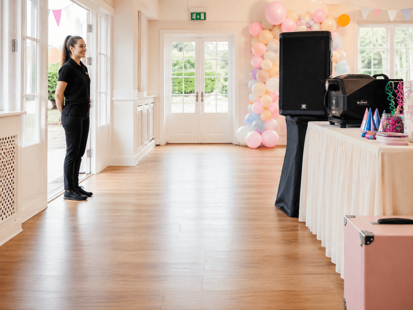 Clear event venue access with party equipment positioned away from walkways