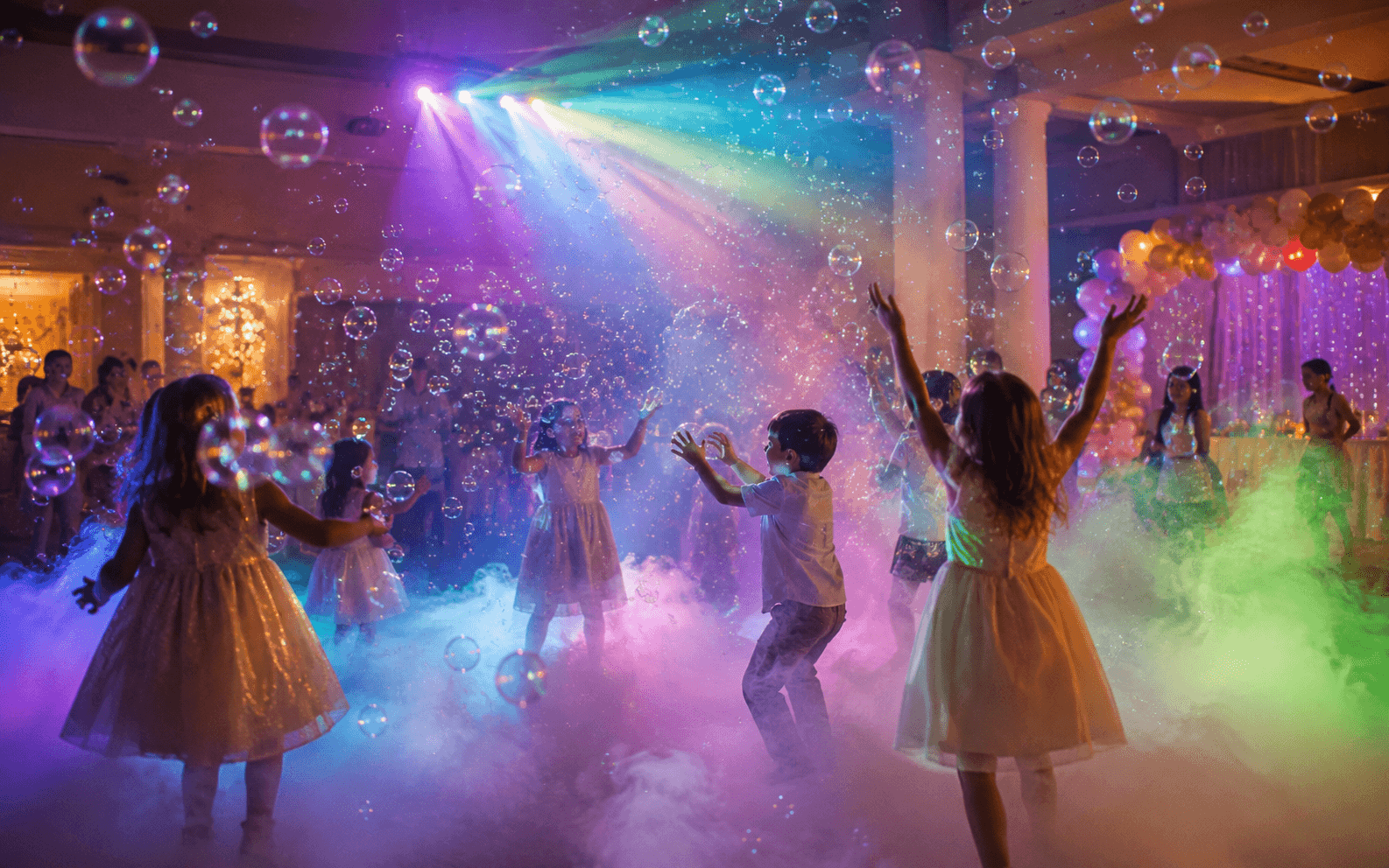 Low fog, bubbles and coloured party lighting at a celebration from Cameron's Events